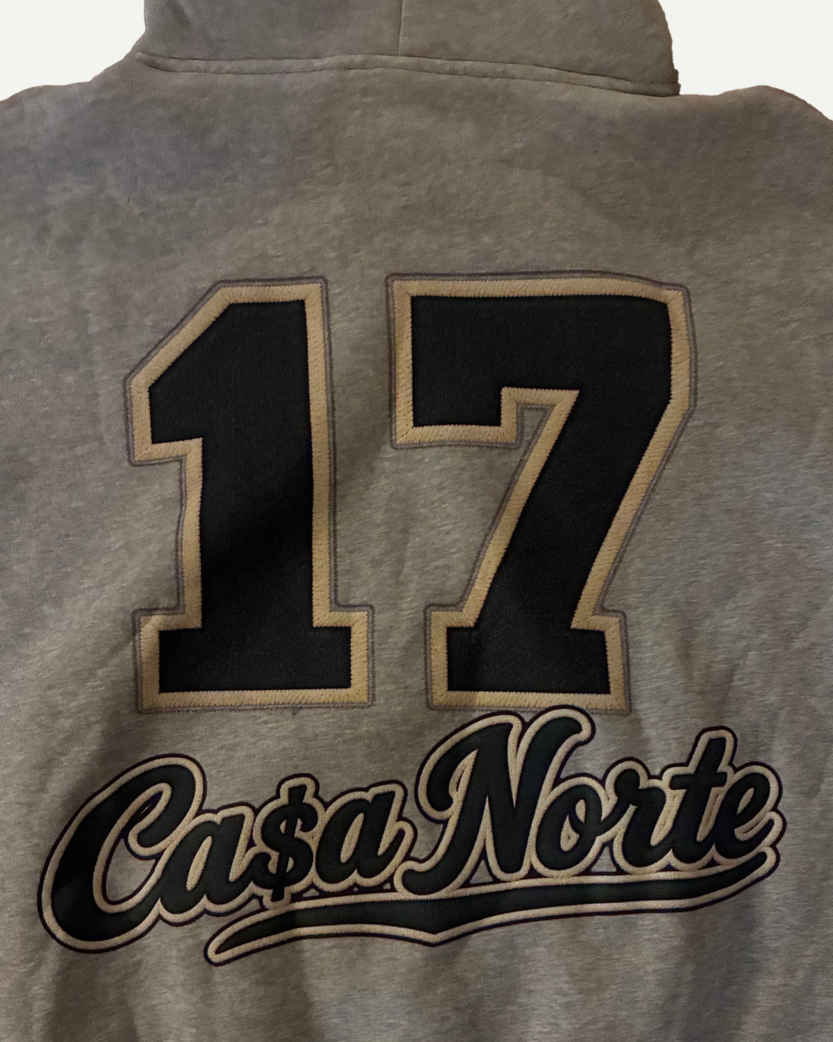“17” Ca$a Norte back graphic close-up