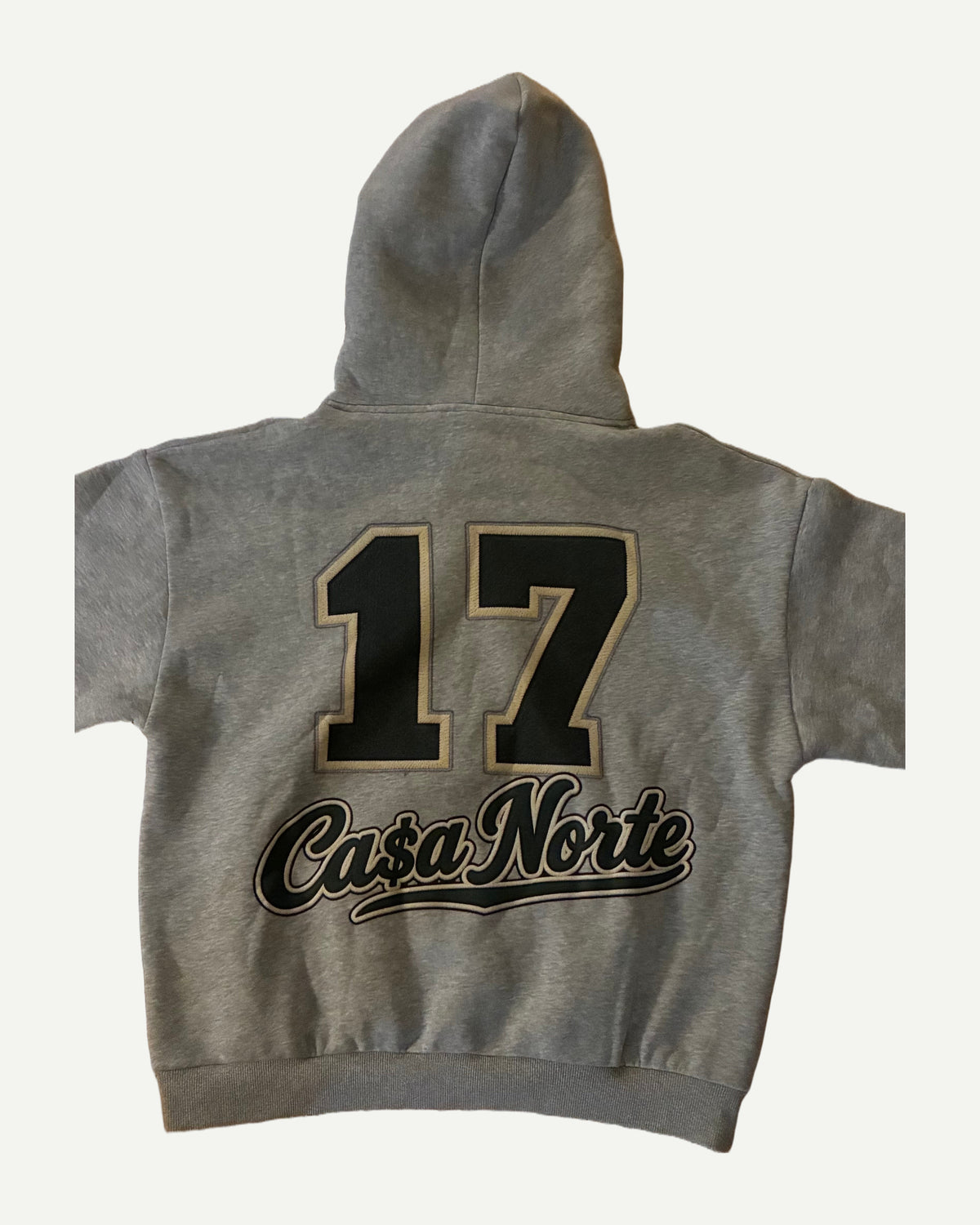 “17” by C$N gray hoodie, back with “17” Ca$a Norte graphic